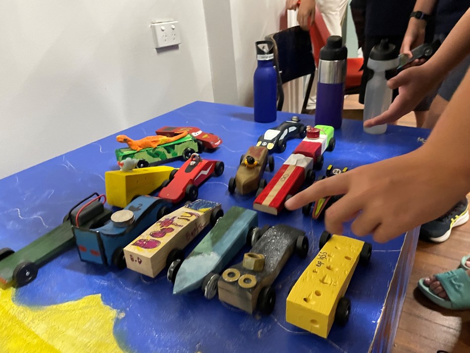 Picture depicting wooden racing cars made by 1st Leichhardt Scouts